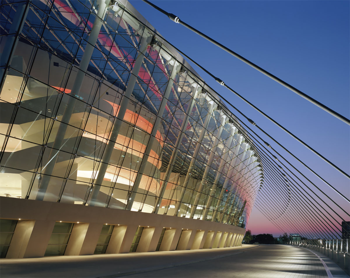 Externat view of Kauffman Center for the Performing Arts at sunset, a large beautiful building with glass walls