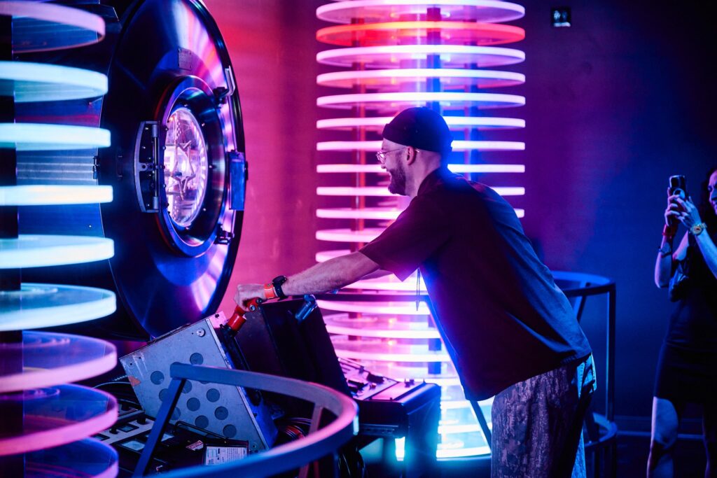 A man playing with an interactive installation at Atlas 9. 