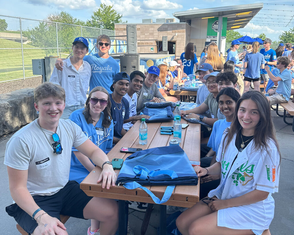 A table of interns smile at Intern Night at the K. 