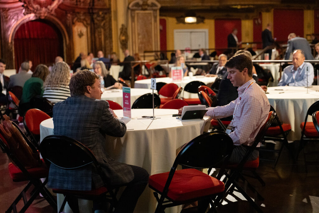 Attendees of the Animal Health Summit talking