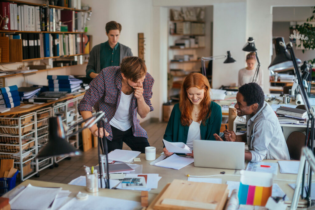 Team collaborating together at a desk