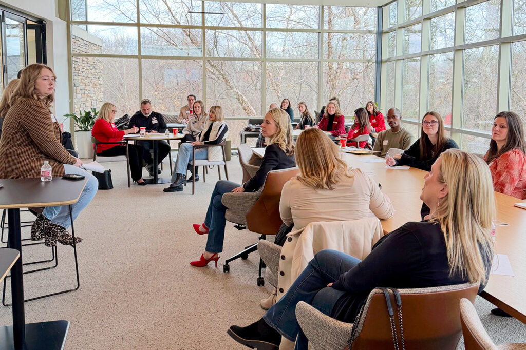 People gathered in a room for a KC Global Design Marketing Swap