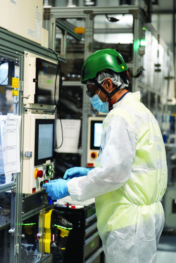 Employee working on a Panasonic battery line.