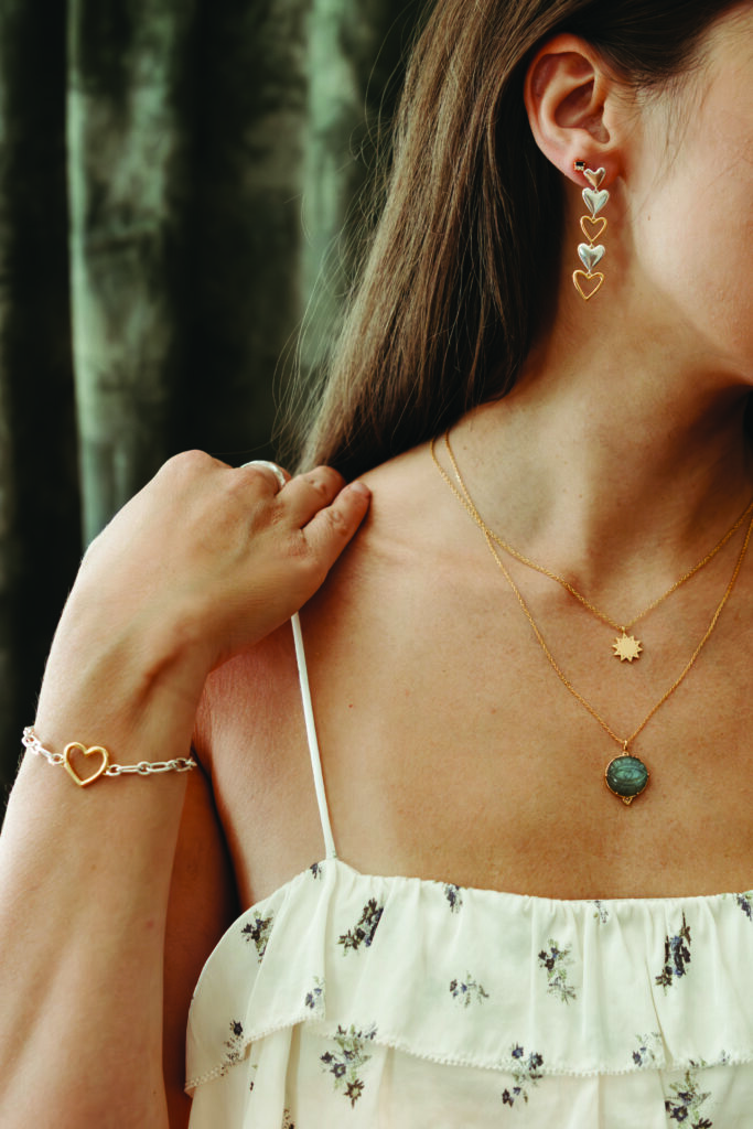 A woman wearing a necklace from Sierra Winter Jewelry. 