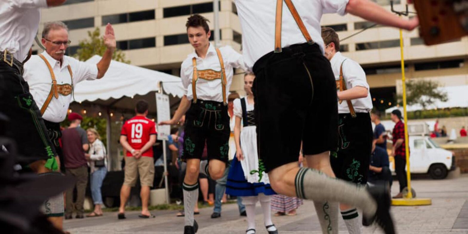 Group of young men in Lederhosen dancing