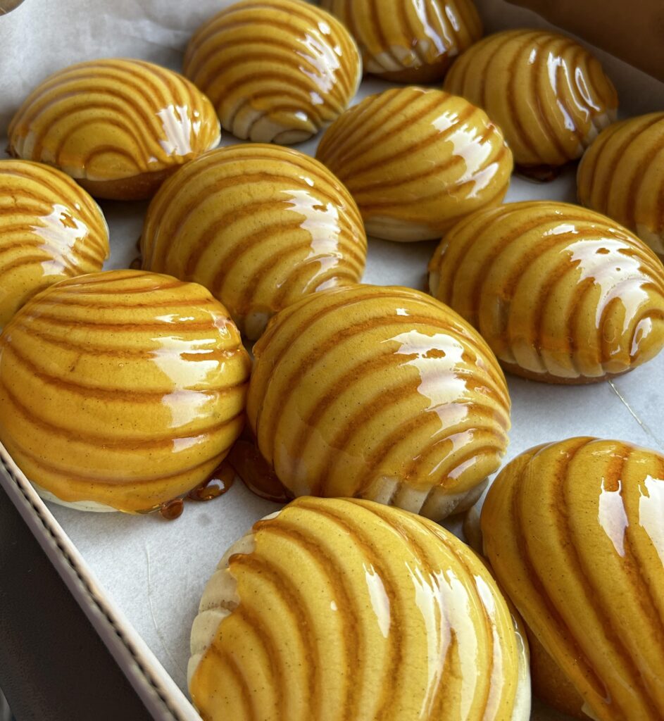 A tray of creme brûlée conchitas from Aurora Bakery & Cafe. 