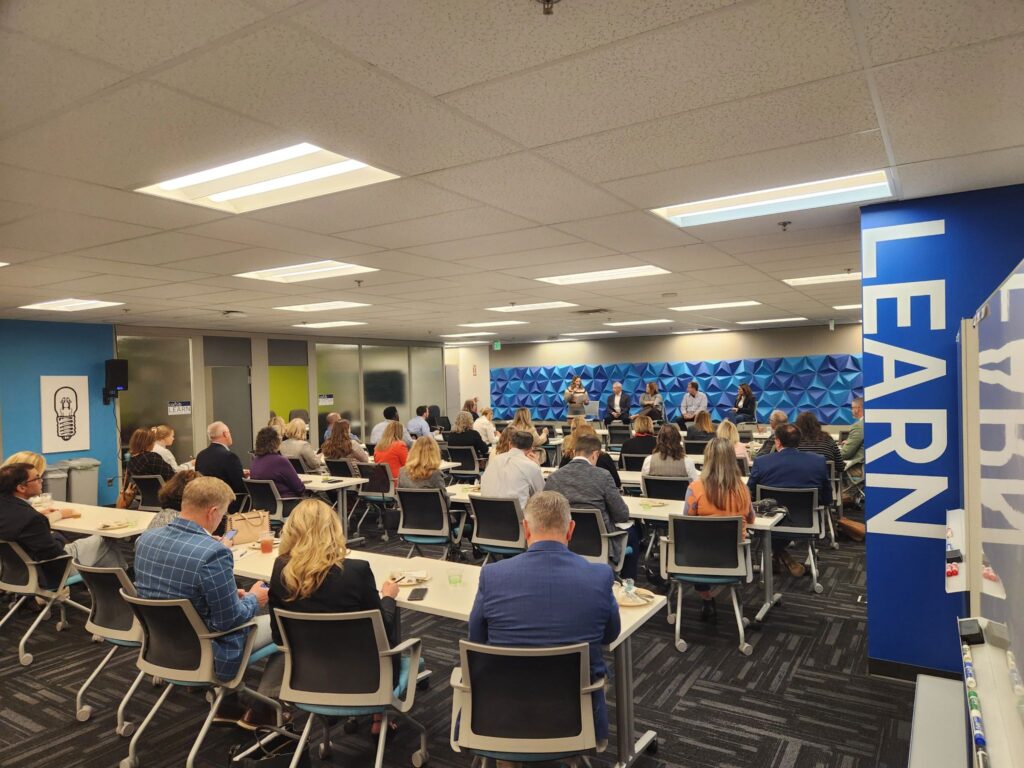 Group listens to a panel presentation