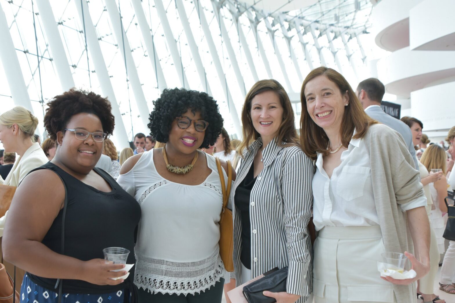 Four women take photo at United WE Conference.