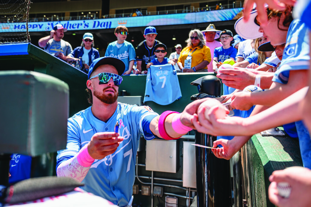 Royals player, Bobby Witt Jr., interacting with fans.
