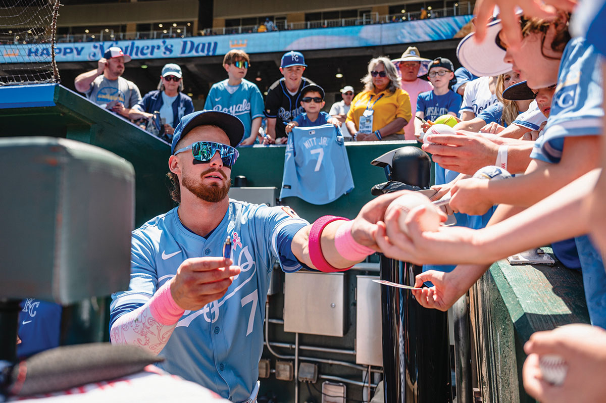Royals player, Bobby Witt Jr., interacting with fans.