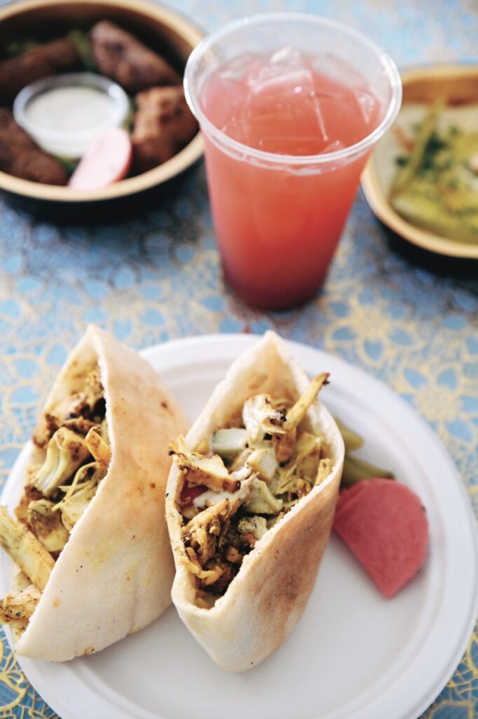 A plate of food and drink from Baba's Pantry.