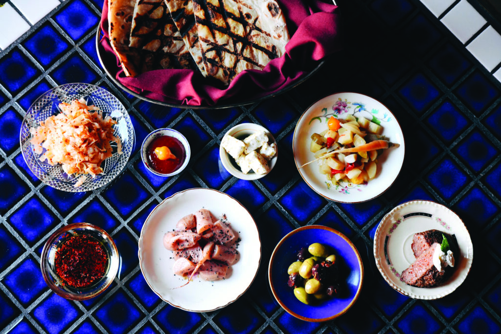 Spread of dishes on a blue tablecloth