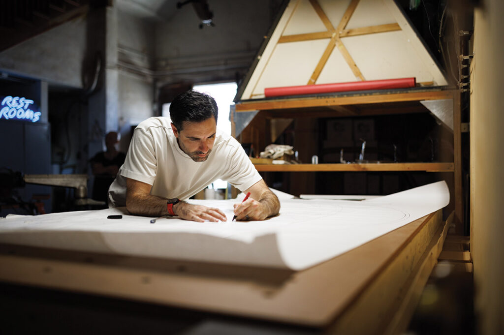 Dylan working on a draft of a neon sign.