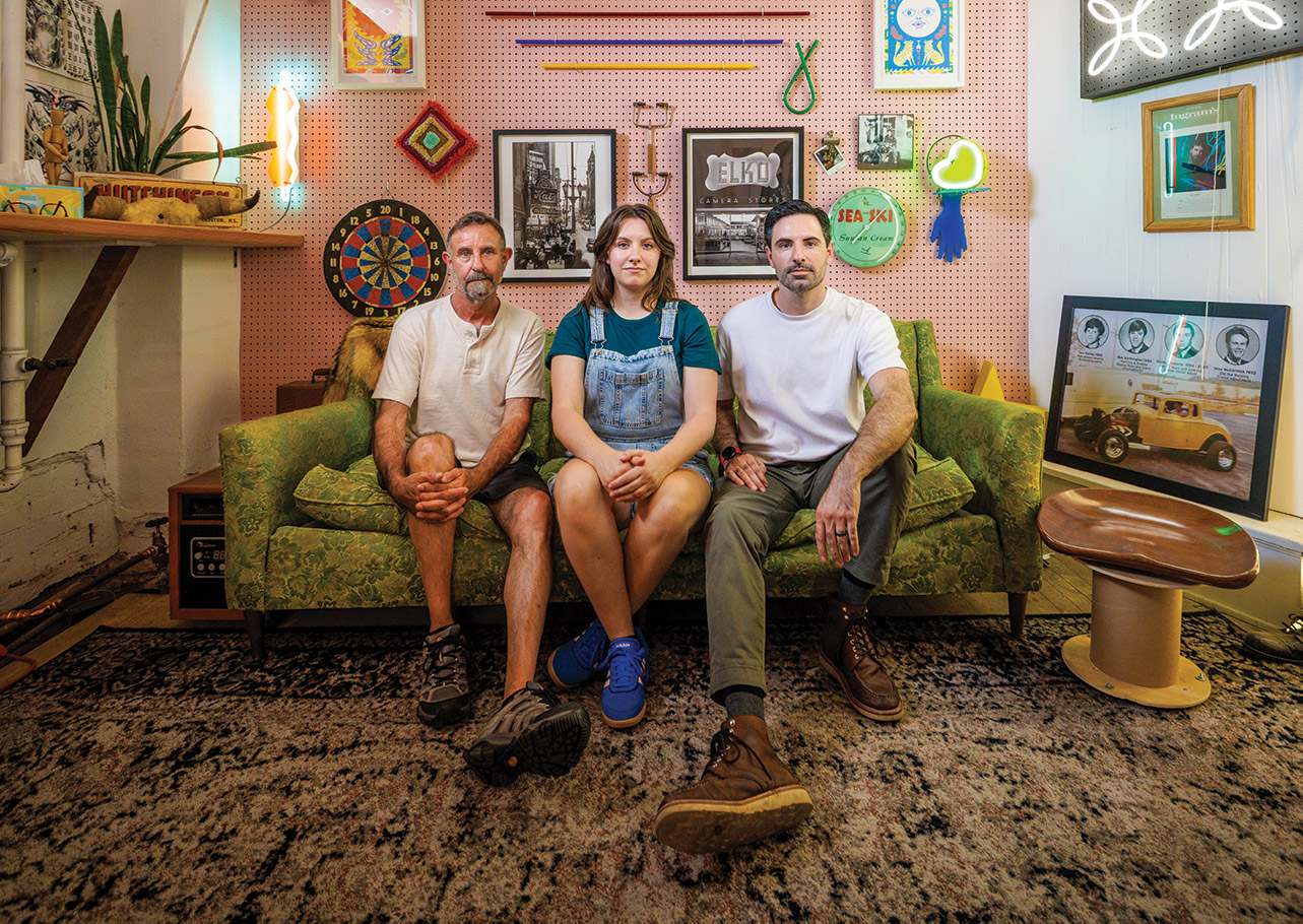 The family behind Element Ten, sitting on a couch in their studio.