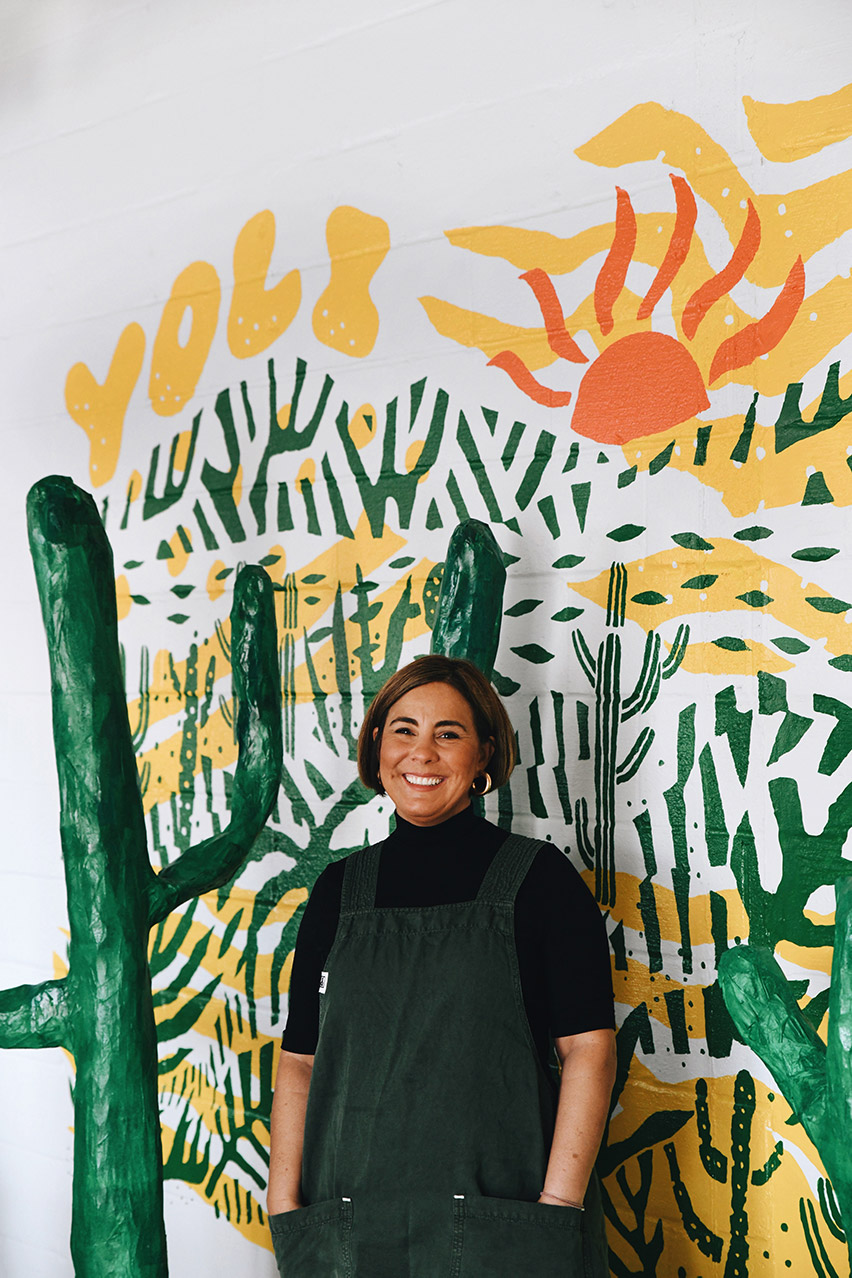 Marissa Gencarelli in front of a southwestern mural.