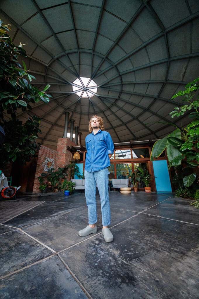 Kevin Morby standing inside the Campbell Dome House.