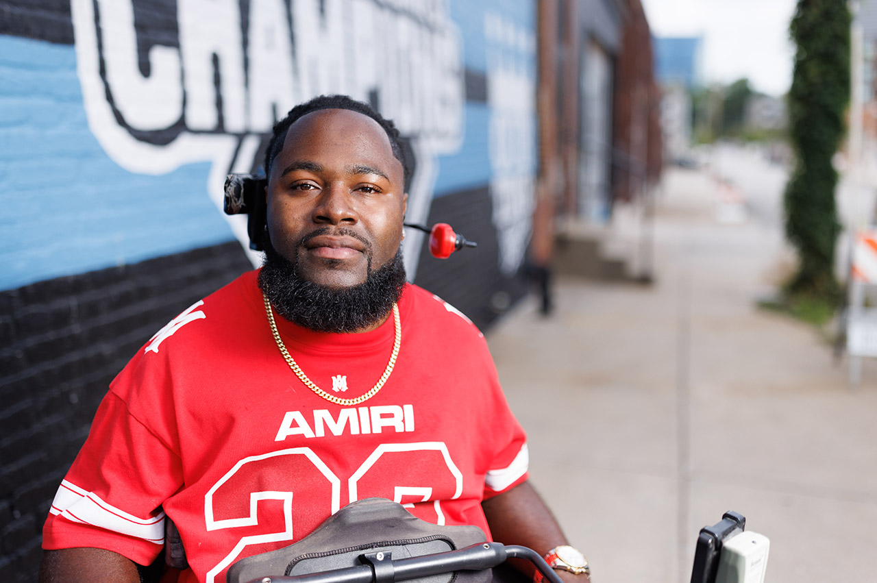 Will Smith in front of a Royals mural.