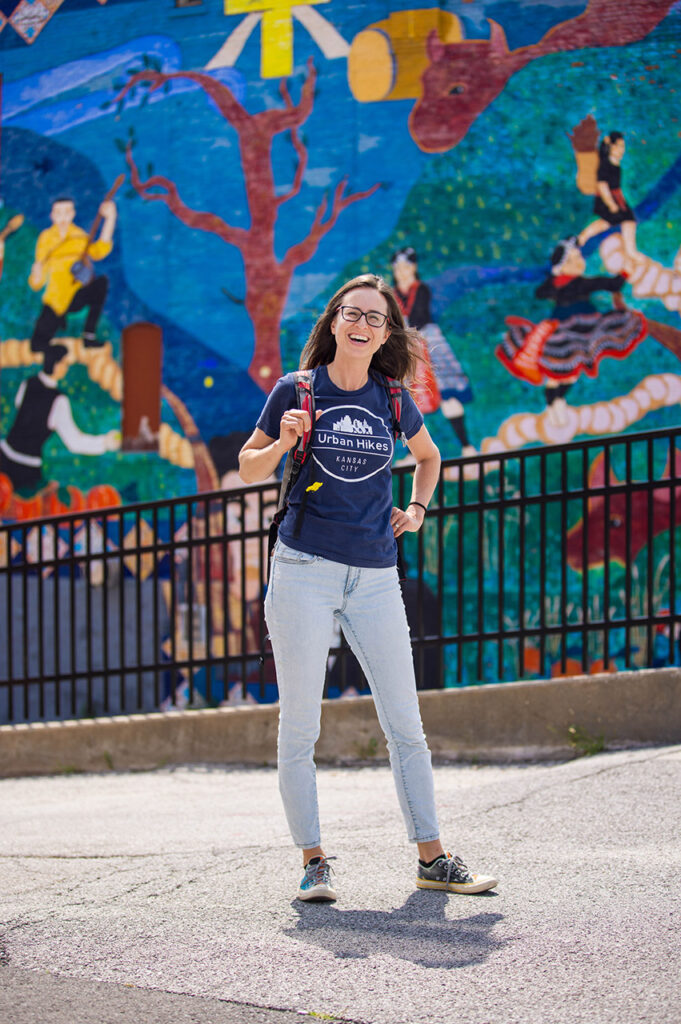 Lisa Pena in front of a mural.