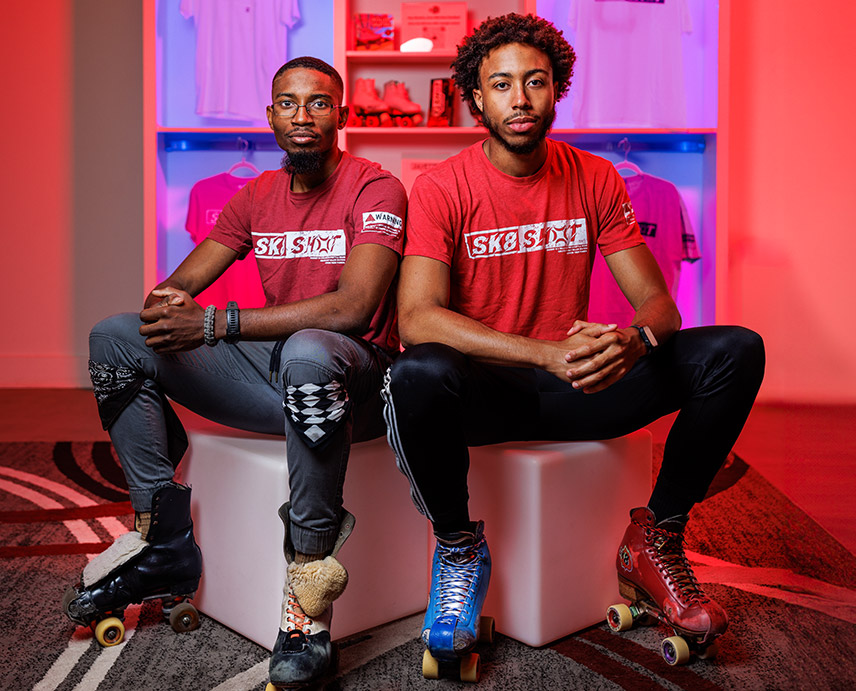 Knejie Allen and Adontis Atkins sitting together.