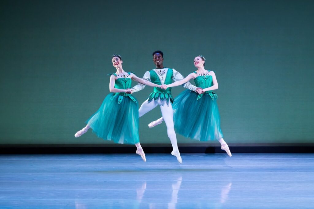 Three ballet dancers in turquoise costumes