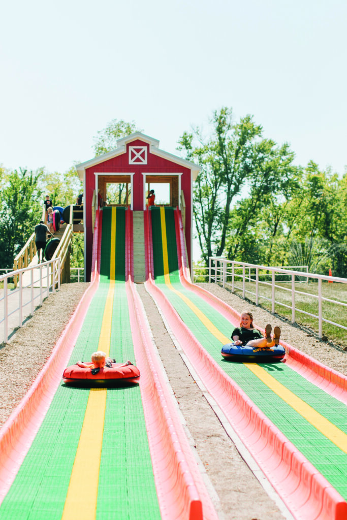 A mom and son tube sliding at Faulkner's Ranch. 