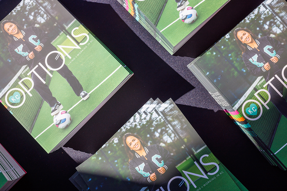 Covers of KC Options magazine featuring Lo'eau LaBonta in a black and teal tracksuit